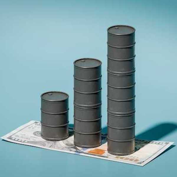 A stack of three oil barrels on top of a one hundred dollar bill against a blue background