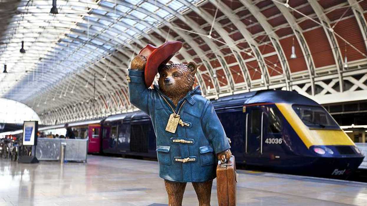 A statue of Paddington Bear in Paddington Station in London, UK