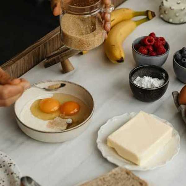 A table with types of food including eggs, butter and fruit