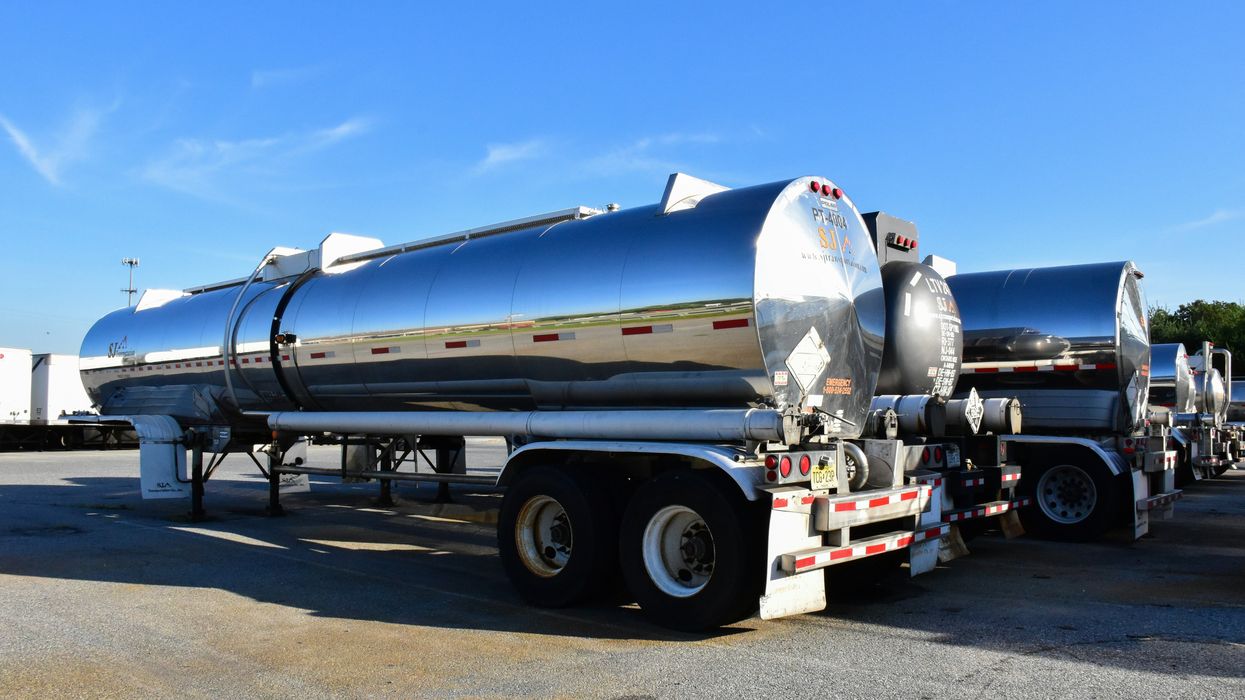 A tanker truck parked in a lot.