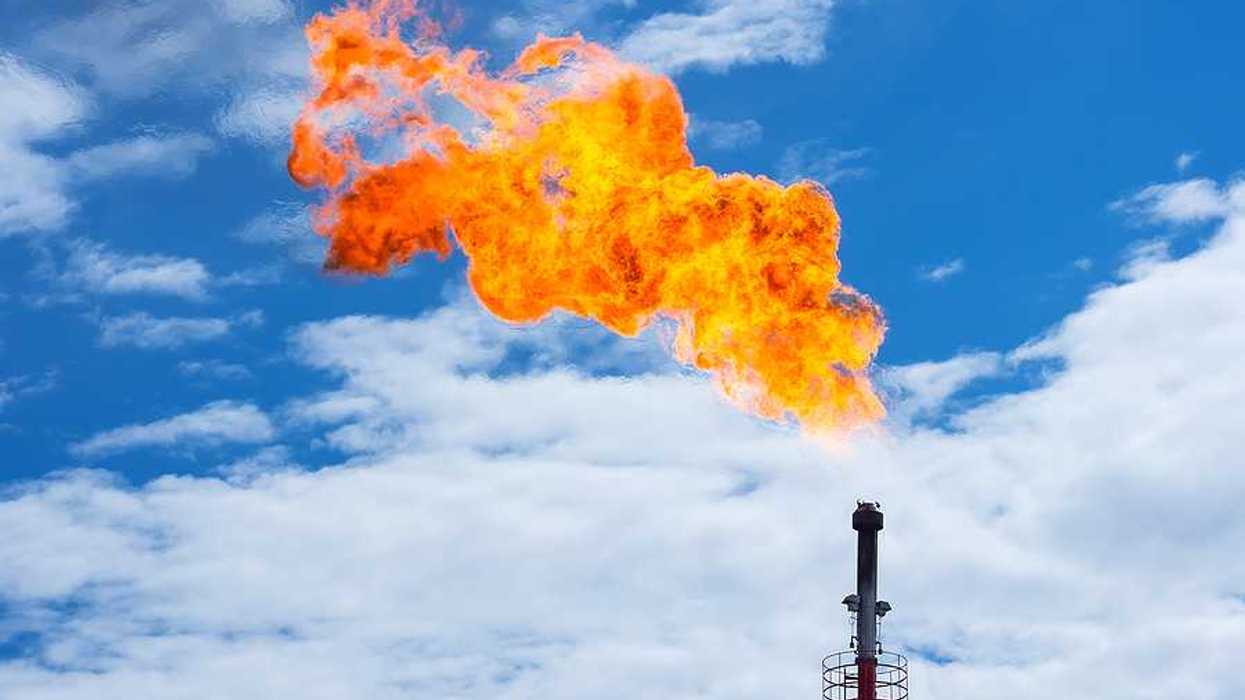 A tower flaring gas and flames into the sky