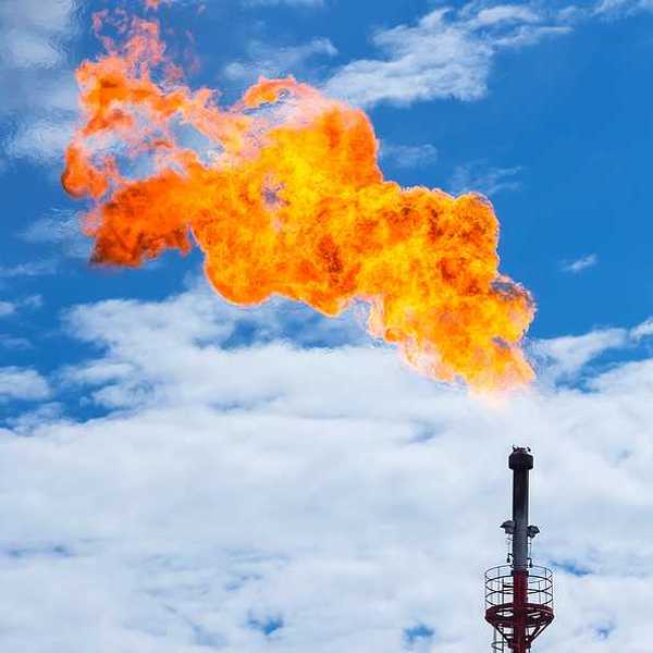 A tower flaring gas and flames into the sky