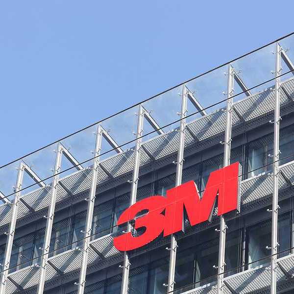A view of a building with the 3M logo in red on the side