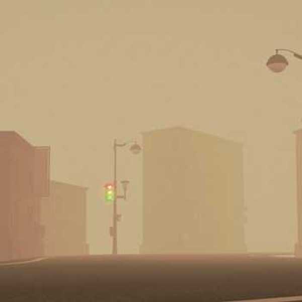 A view of a city street with smog or smoke in the air