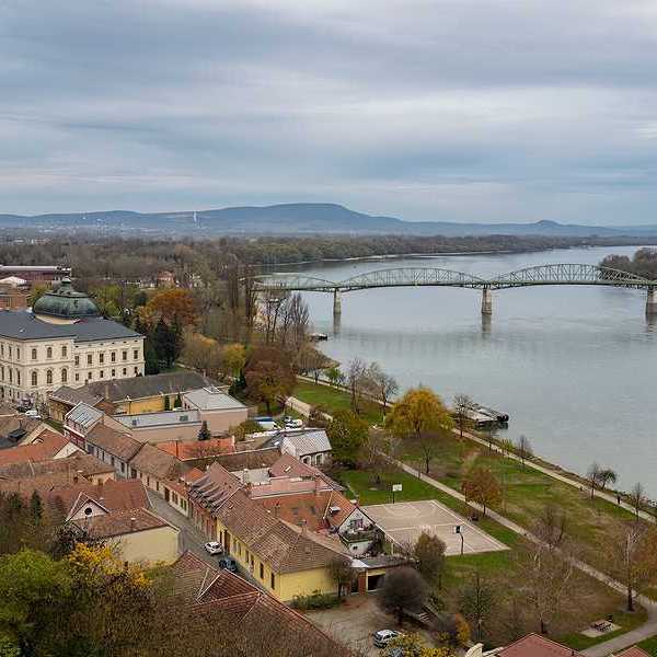 A view of a European city with a river next to it