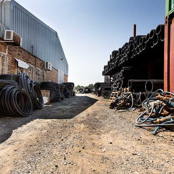 A view of a factory with brick and metal buildings