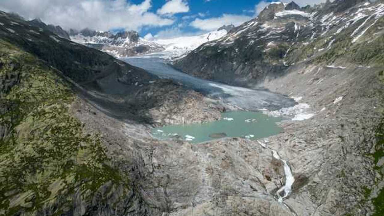 A view of a glacier retreating from a rocky landscape