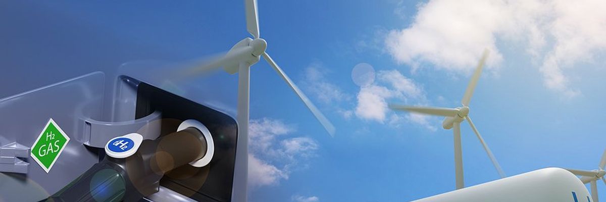a view of a hydrogen car being charged with wind turbines and a solar panel in the background
