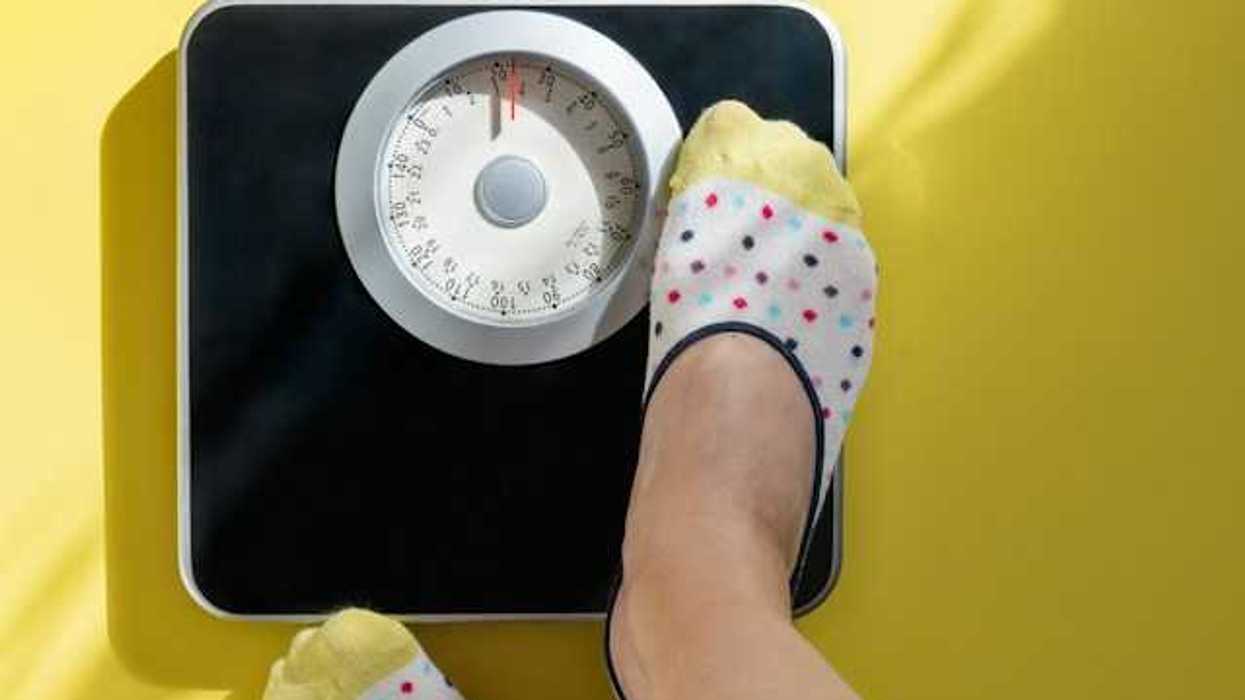 A view of a person standing on a weight scale