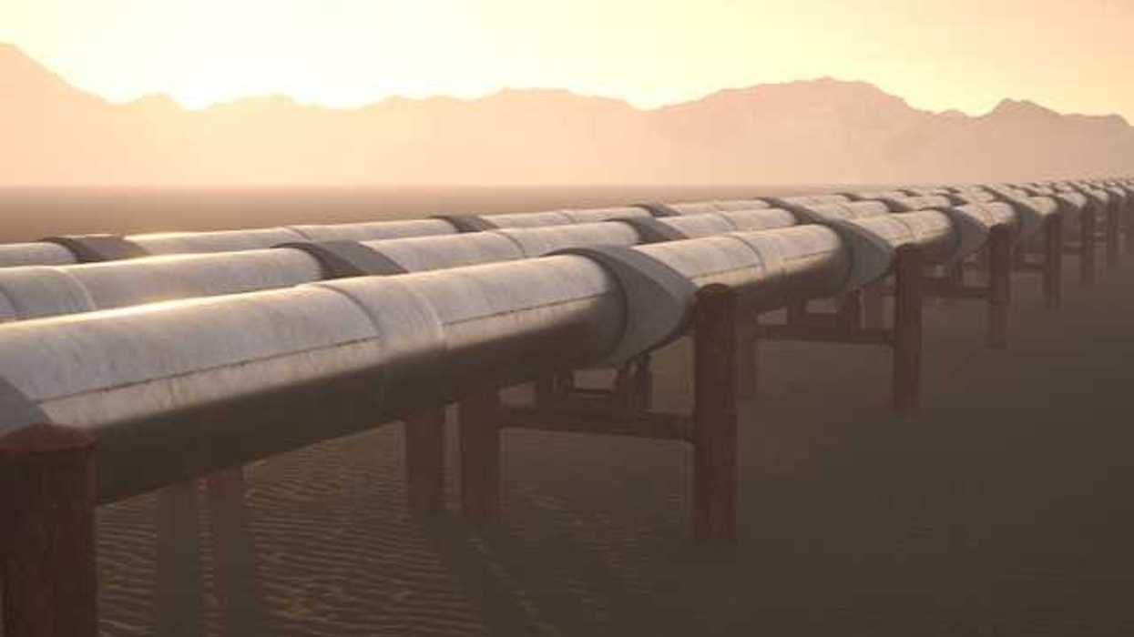 A view of a pipeline stretching toward mountains in the background