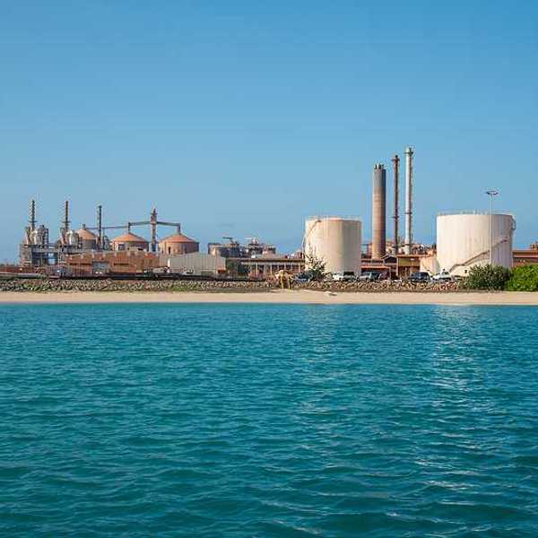 A view of a refinery on the edge of the water