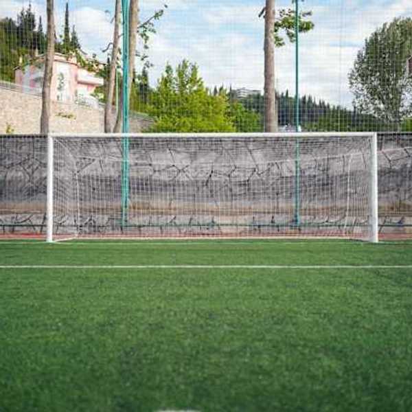A view of a soccer field with artificial turf