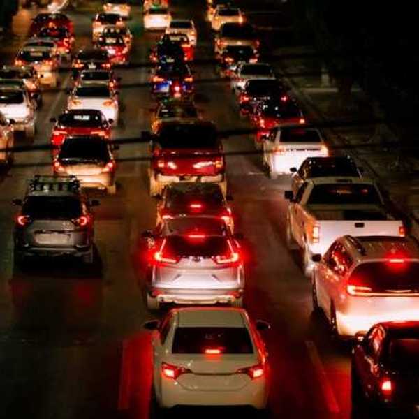 A view of a traffic jam with many cars and red brake lights