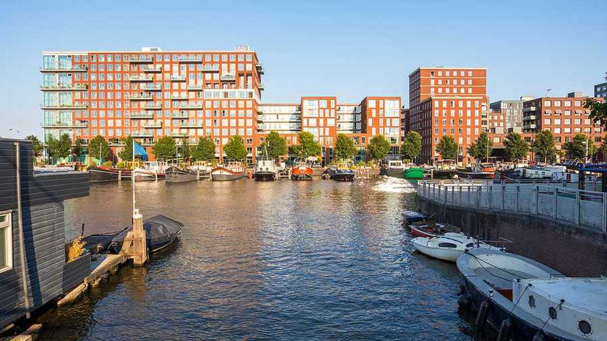 A view of Amsterdam apartment buildings from a dock