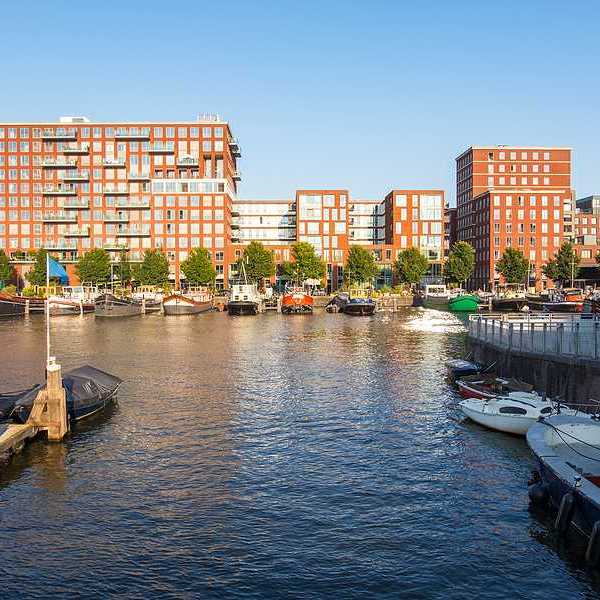 A view of Amsterdam apartment buildings from a dock