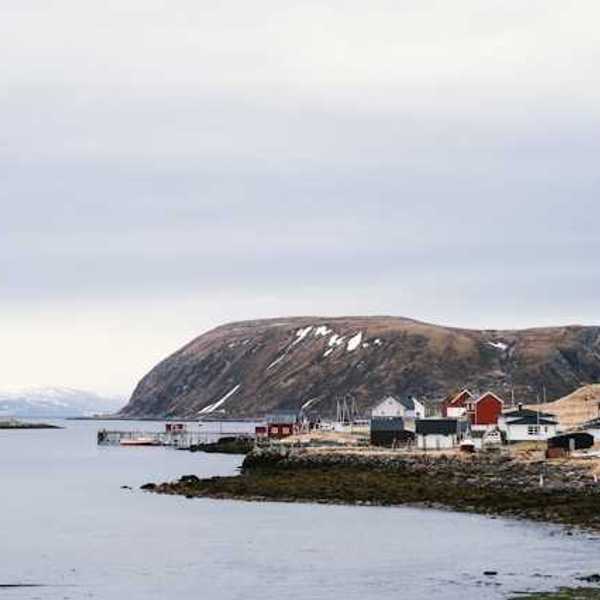 A view of an Alaskan village on the edge of a body of water