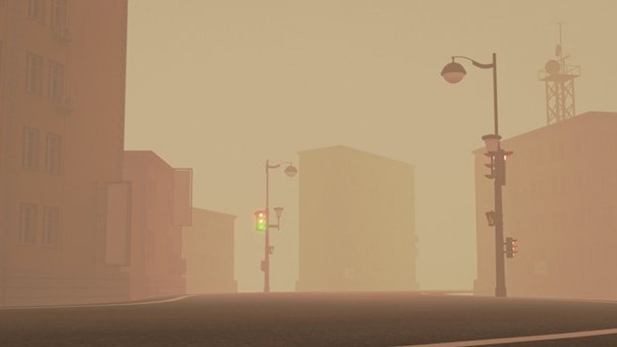 A view of an empty smoky street with street lights