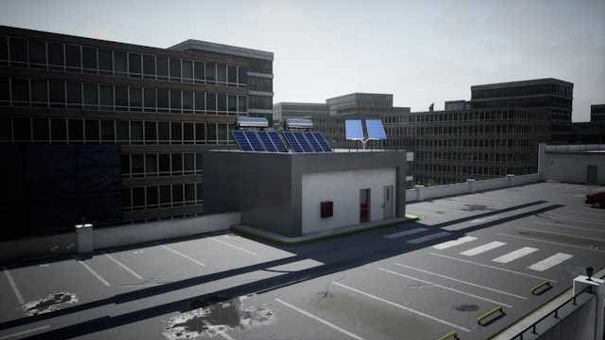 A view of an office building roof with solar panels on it