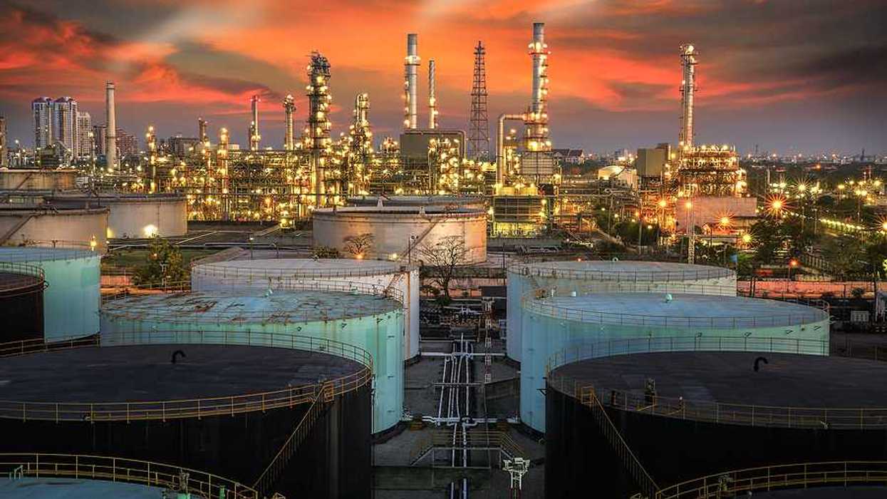 A view of an oil refinery at sunset
