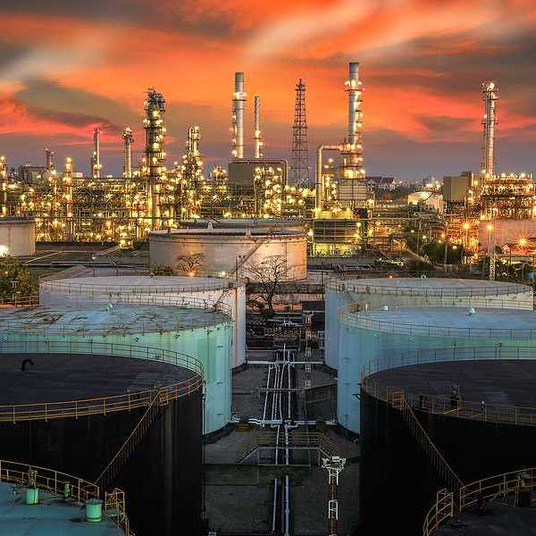 A view of an oil refinery at sunset