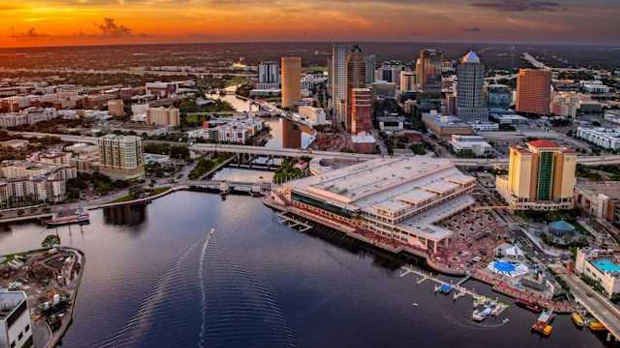 A view of downtown Tampa, Florida along the Hillsborough river against a night sky
