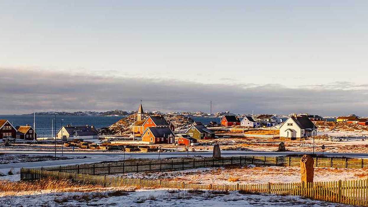 A view of houses in a wintry landscape