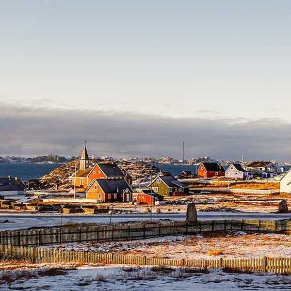 A view of houses in a wintry landscape