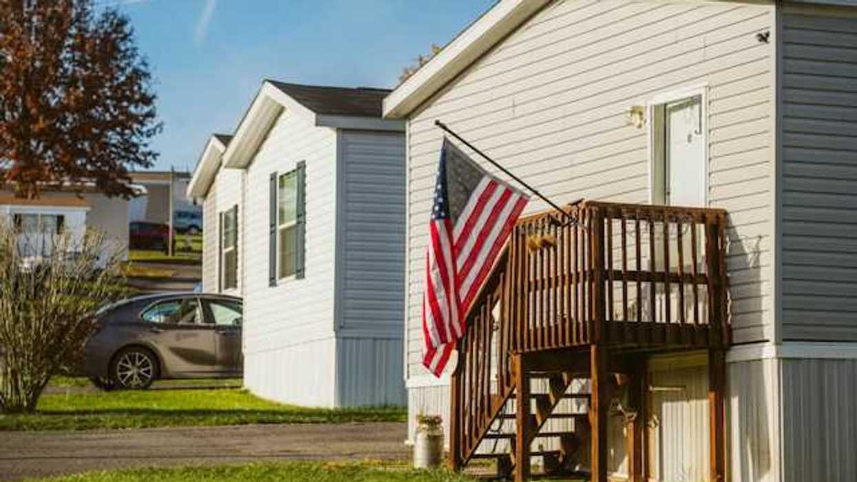 A view of manufactured homes with a U.S. flag flying outside