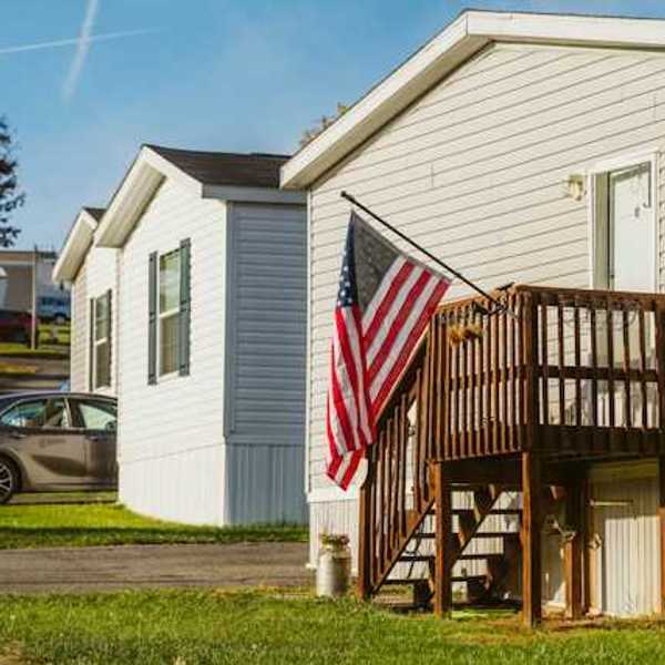 A view of manufactured homes with a U.S. flag flying outside