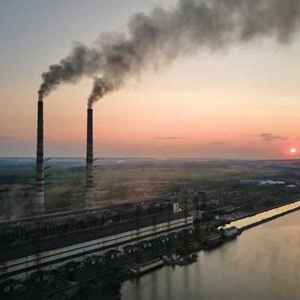 A view of smokestacks spewing pollution into the air