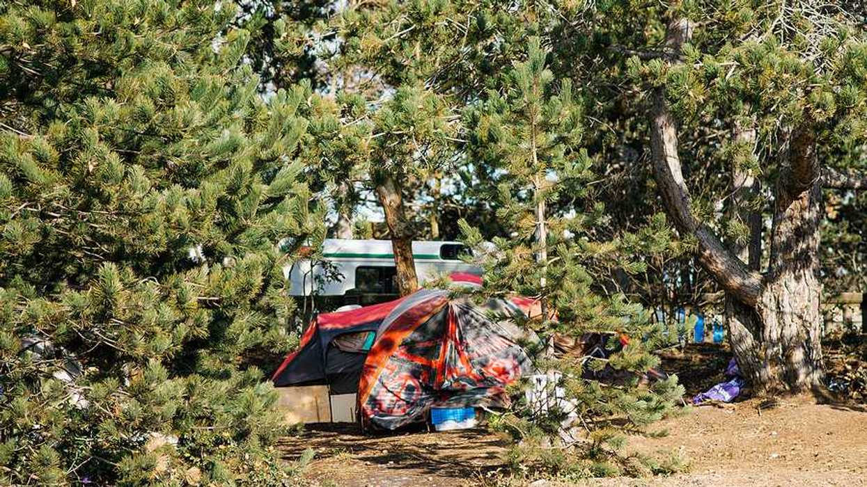 A view of tents and RVs in a homeless encampment