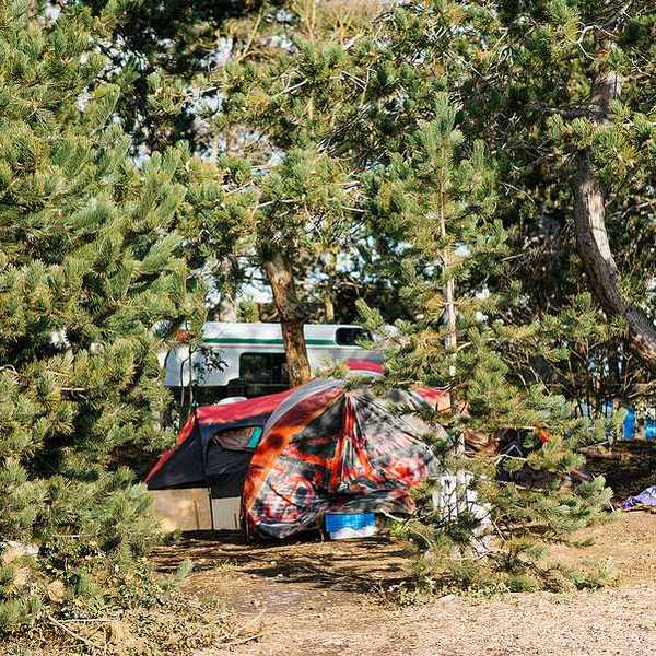 A view of tents and RVs in a homeless encampment