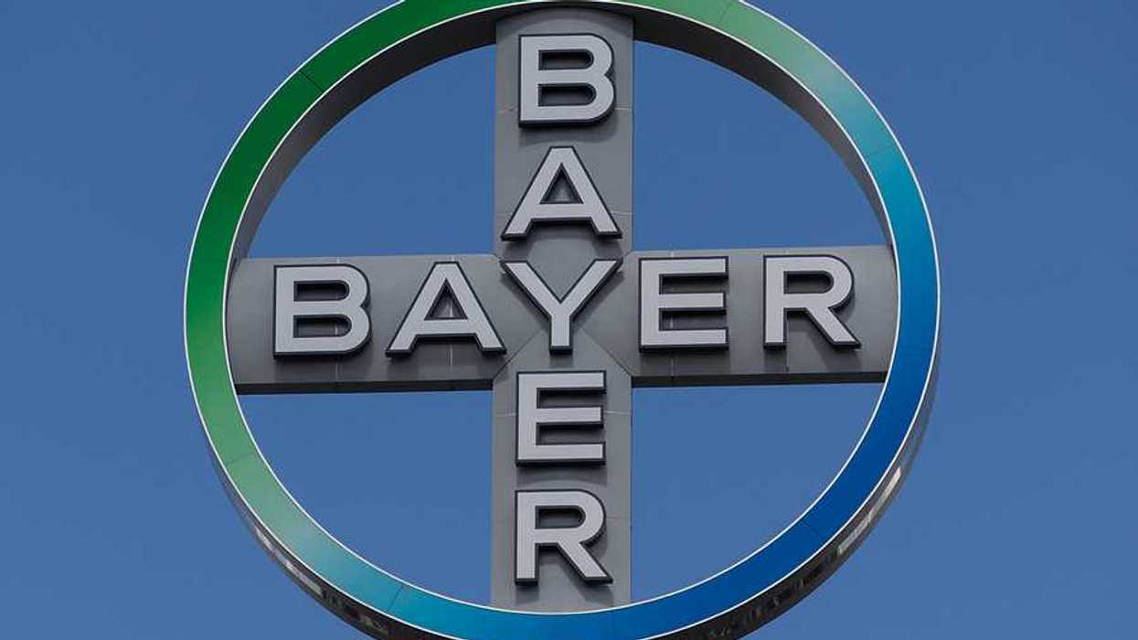 A view of the Bayer logo against a blue sky