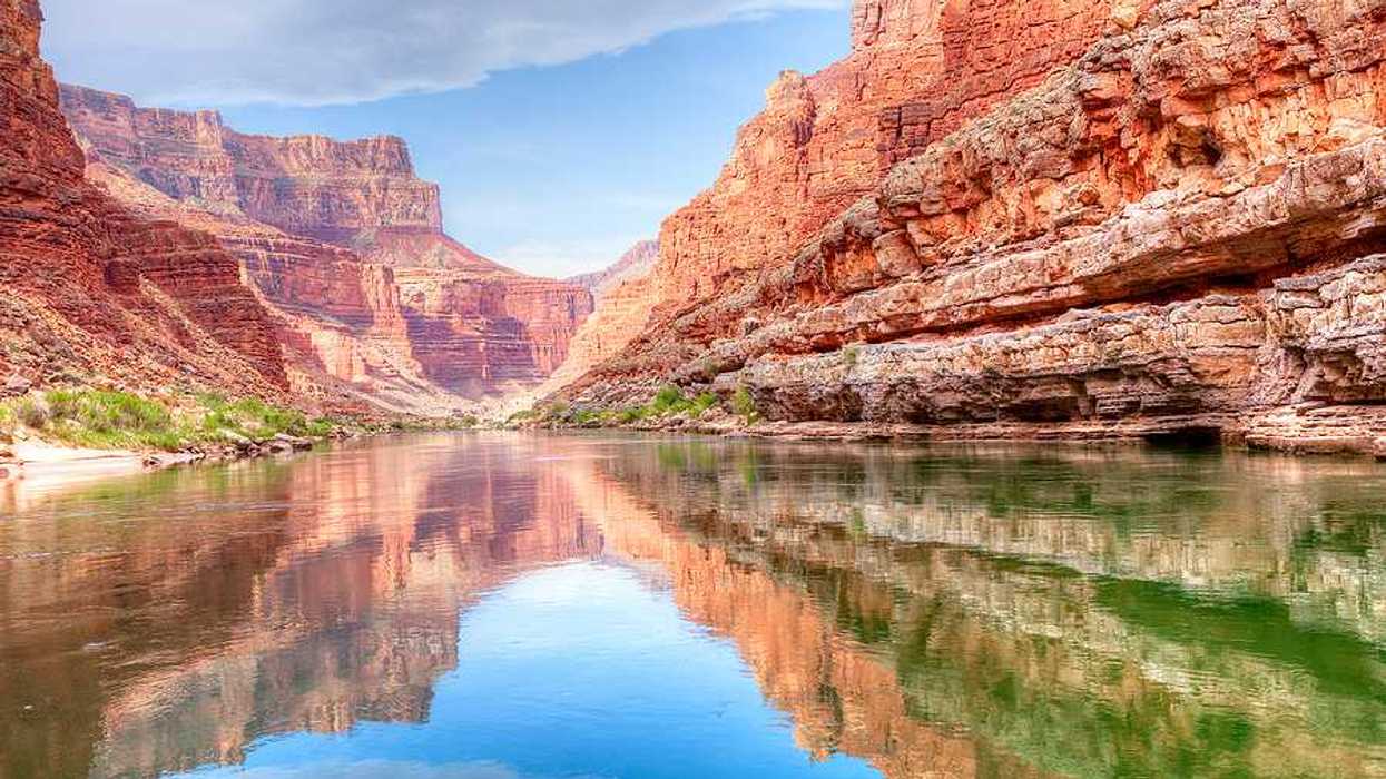 A view of the Colorado River from the bottom of a canyon