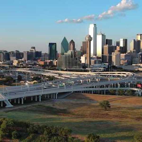 A view of the Dallas skyline with freeways in the foreground