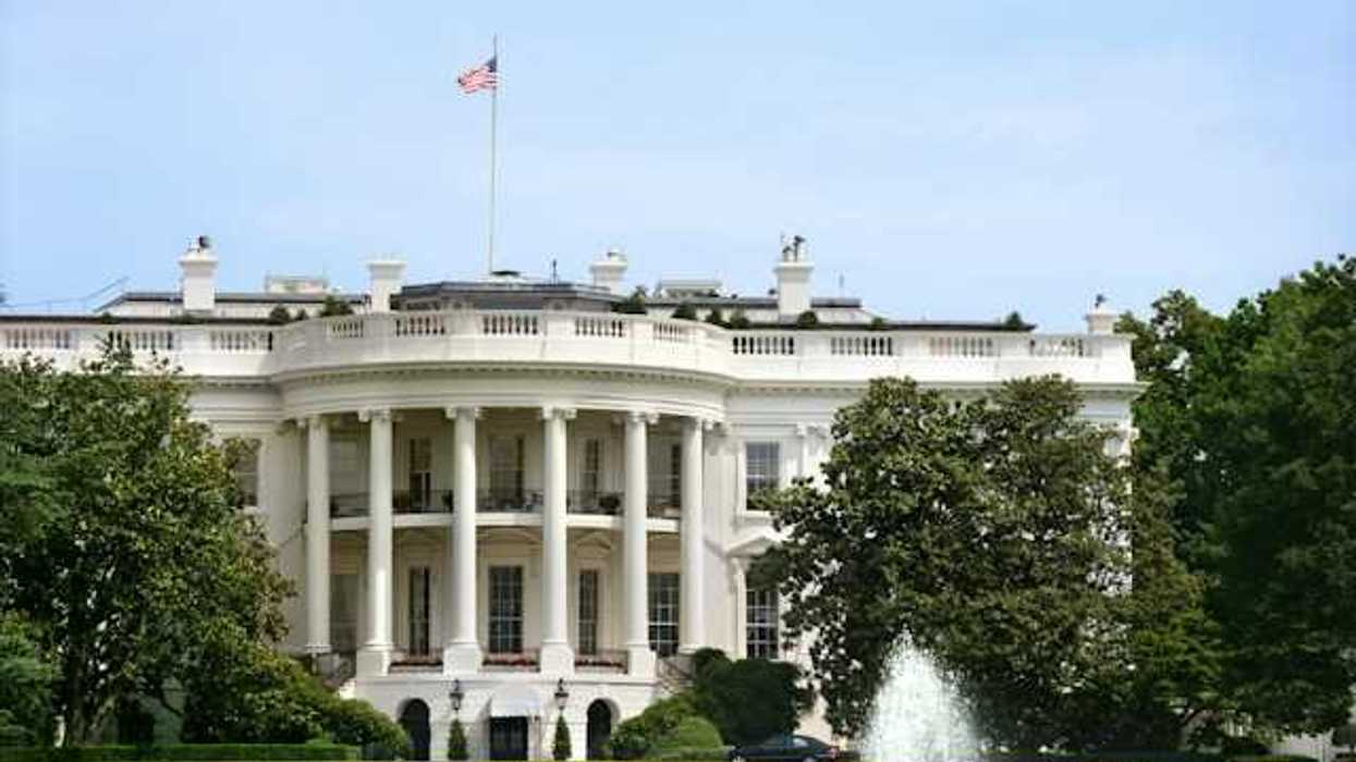A view of the front of the White House on a sunny day