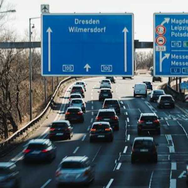 A view of the German autobahn with blue city signs