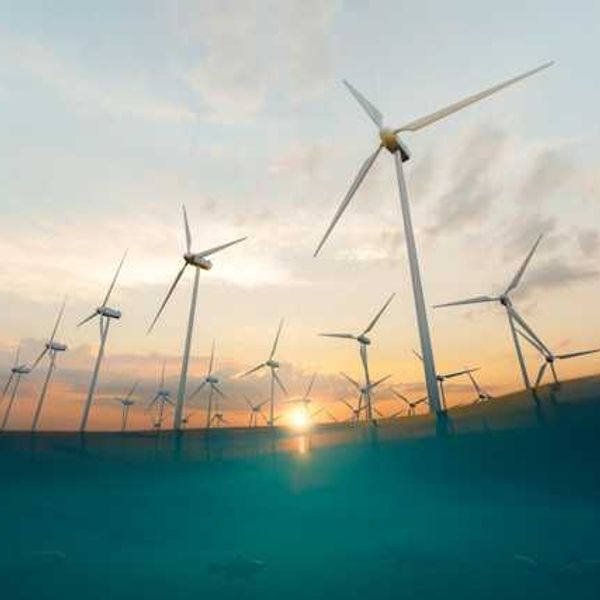 A view of wind turbines as if from beneath the water