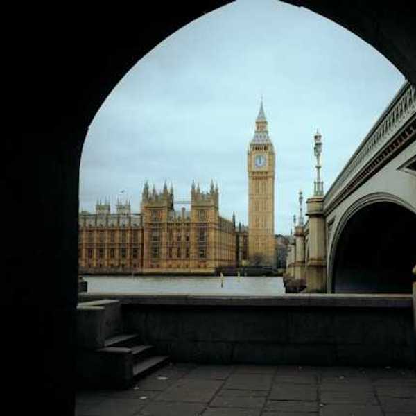 A view through an arch of Big Ben clock and the parliament building in London