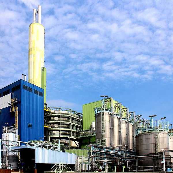 A waste incinerator facility with a blue sky in the background