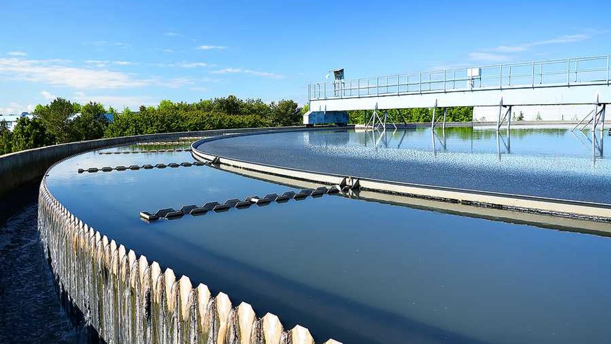 A wastewater tank filled with water on a sunny day