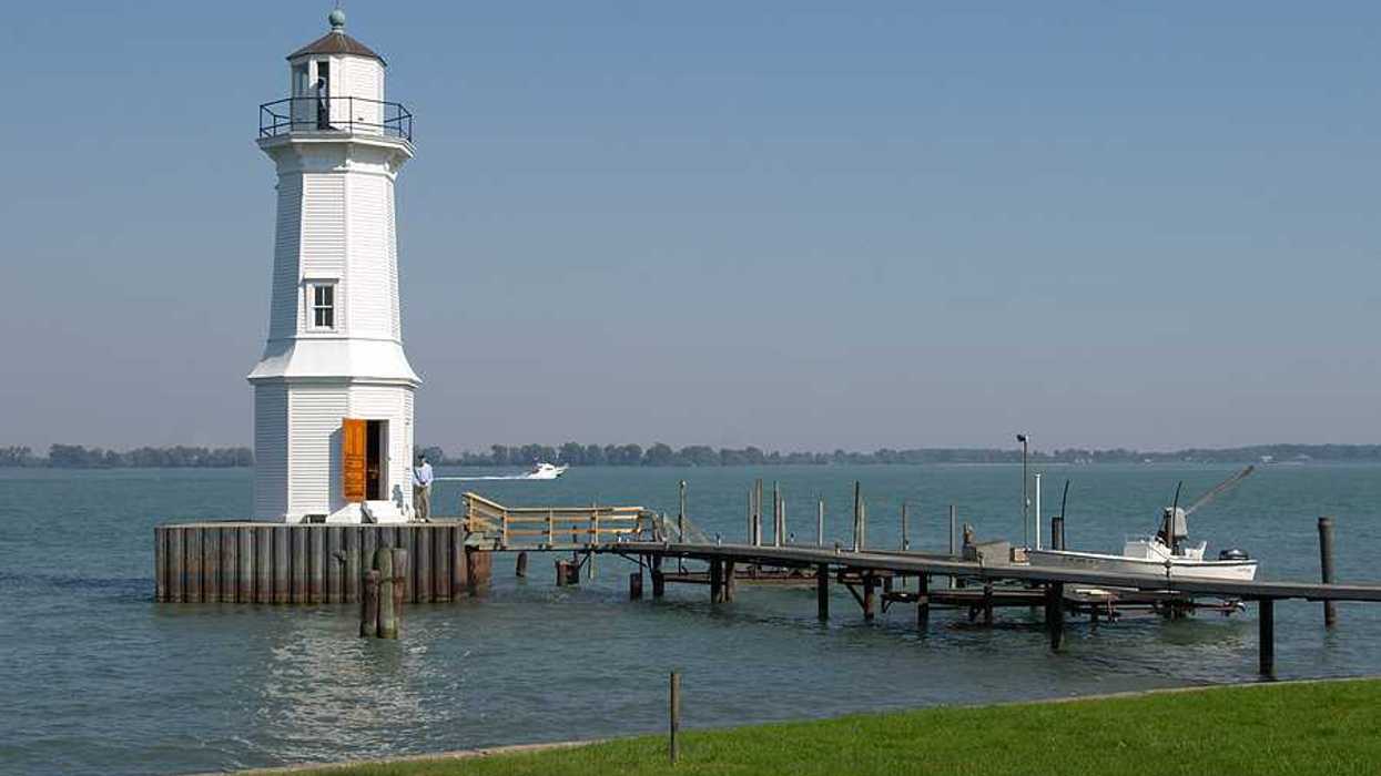 A white lighthouse in a lake