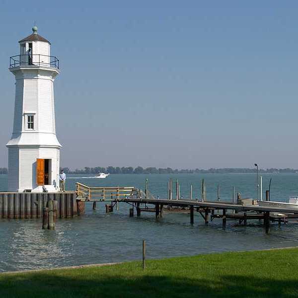 A white lighthouse in a lake
