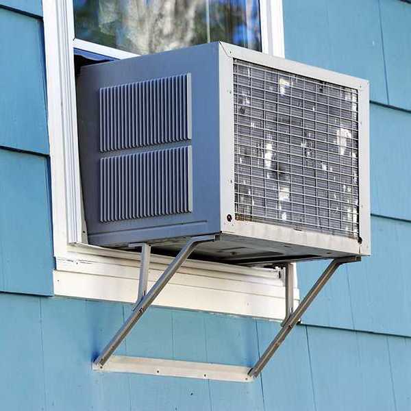 A window air conditioner viewed from the outside of a house