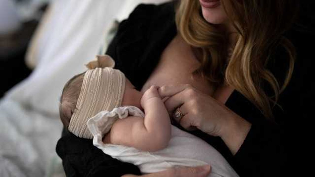 A woman breast feeding her child