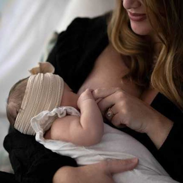 A woman breast feeding her child