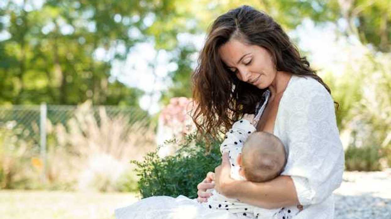 A woman breast feeding her child
