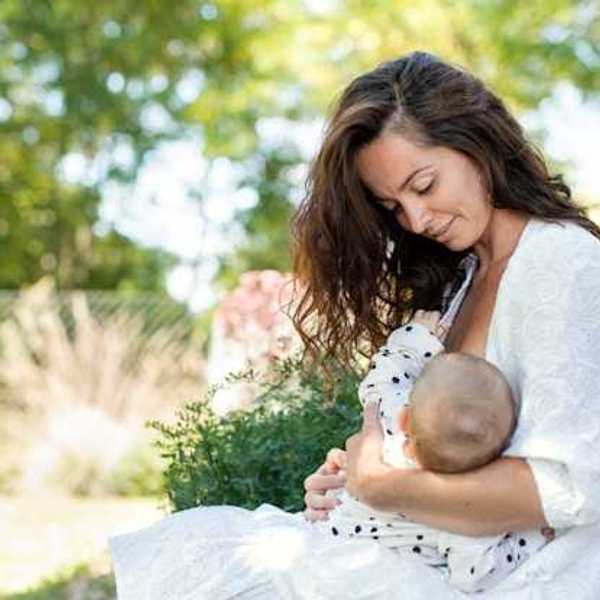 A woman breast feeding her child