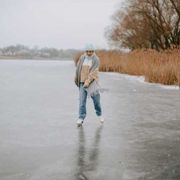 A woman ice skating on a lake