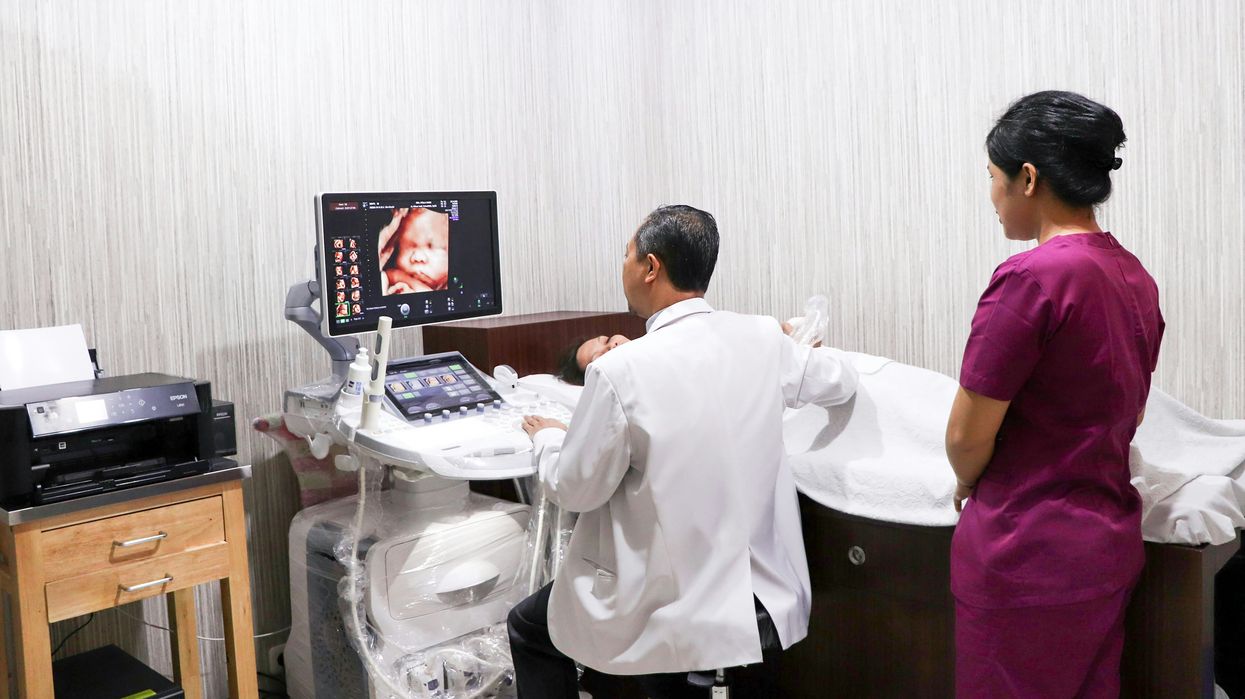 A woman receives an ultrasound